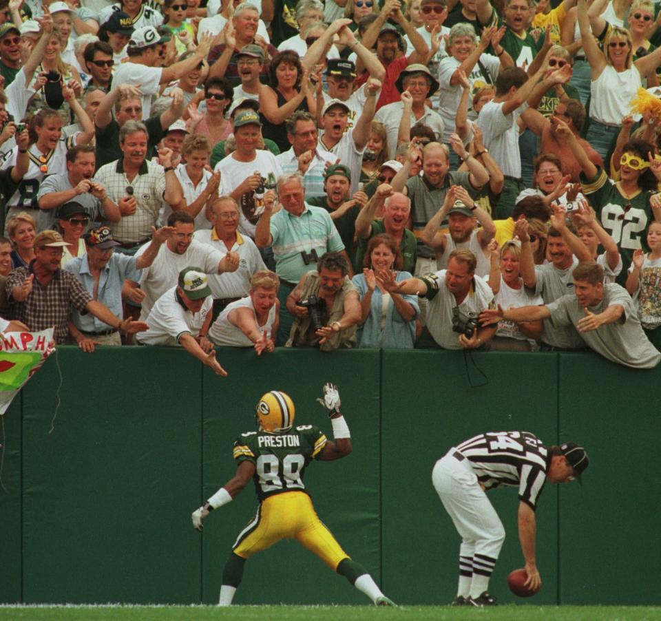 Green Bay Packers returner Roell Preston feels the loves from fans after a kickoff return for a touchdown.