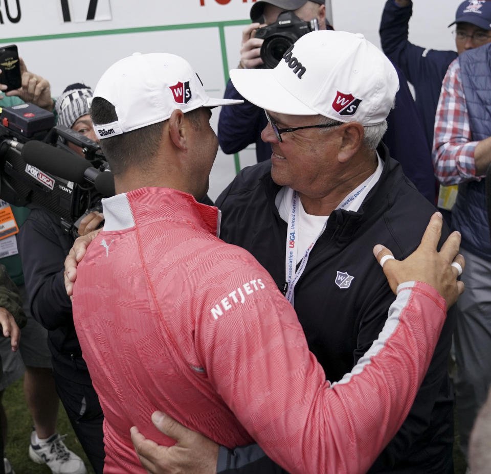 Gary Woodland celebrates after winning the U.S. Open Championship golf tournament with his father Dan, Sunday, June 16, 2019, in Pebble Beach, Calif. (AP Photo/Carolyn Kaster)