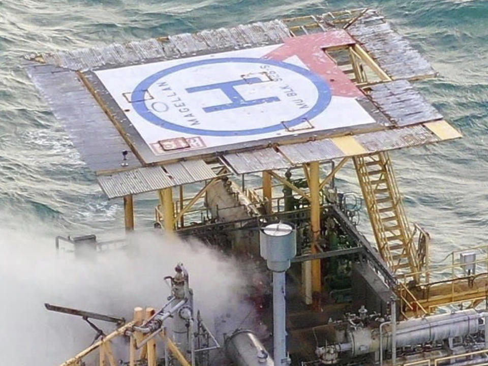 In this image released by the U.S. Coast Guard, natural gas is release from an oil platform approximately three miles offshore of Corpus Christi, Texas, Tuesday, Sept. 1, 2020. Officials responded Tuesday to a release from a well platform off the shore of Texas and the Coast Guard has a pollution response team on the beach to monitor the situation. There were no immediate reports of injuries. (U.S. Coast Guard via AP)