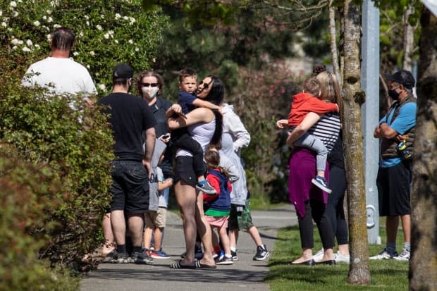 Parents and guardians pick up their children from a daycare attached to the Langley Sportplex where a fatal shooting occurred early in the morning in Langley, British Columbia on Wednesday, April 21, 2021.