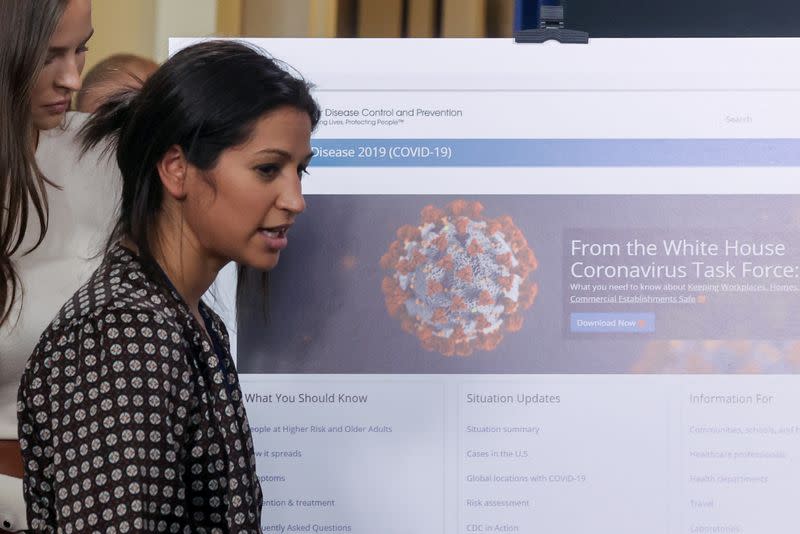 FILE PHOTO: Katie Miller, press secretary for U.S. Vice President Pence, helps prepare for the daily coronavirus task force briefing at the White House in Washington