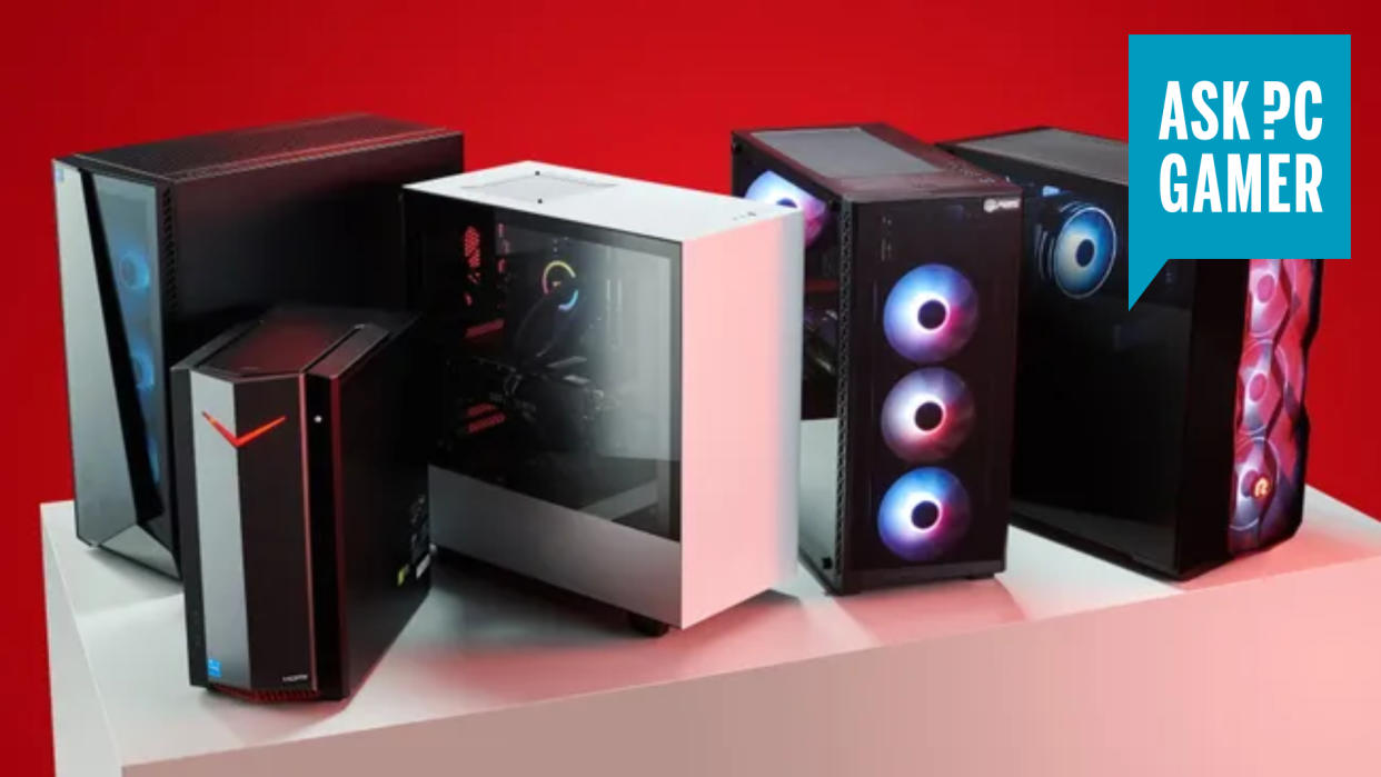  Several gaming PCs on a table in front of a red background, with an "ask PC Gamer" logo in the top right corner. 