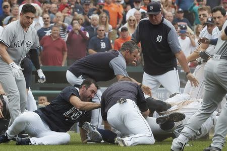 Aug 24, 2017; Detroit, MI, USA; Detroit Tigers manager Brad Ausmus (center) and starting pitcher Justin Verlander (left) try to get players off Detroit Tigers first baseman Miguel Cabrera (bottom right) after benches clear during the sixth inning of the game against the New York Yankees at Comerica Park. Mandatory Credit: Rick Osentoski-USA TODAY Sports