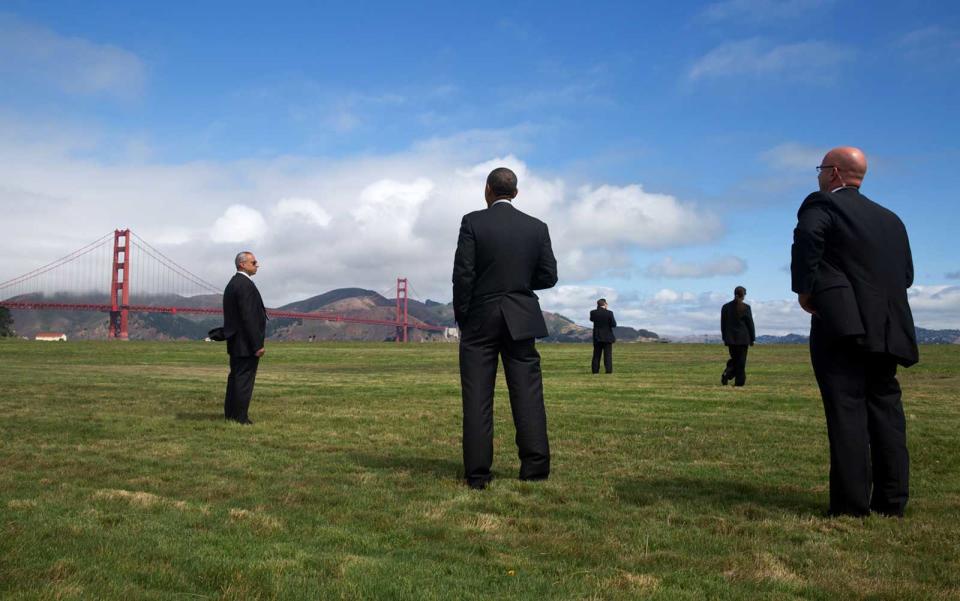 <p>Obama admires a lesser-seen angle of the Golden Gate Bridge from afar. </p>