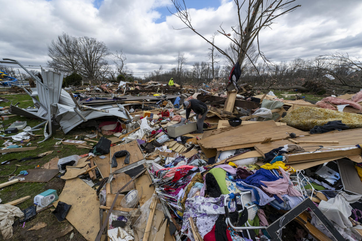 Damage from a late-night tornado is seen in Sullivan, Ind., Saturday, April 1, 2023. Multiple deaths were reported in the area following the storm. (AP Photo/Doug McSchooler)