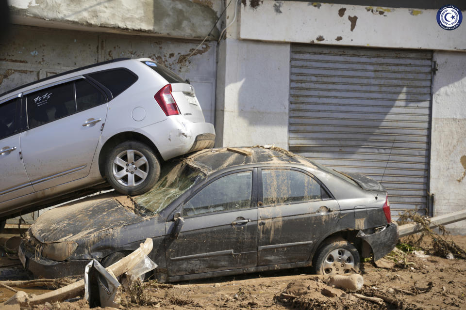 In this photo provided by the Libyan government, cars sit, one stacked on top of the other, after being carried by floodwaters in Derna, Libya, on Monday, Sept. 11, 2023. Mediterranean storm Daniel caused devastating floods in Libya that broke dams and swept away entire neighborhoods and wrecked homes in multiple coastal towns in the east of the North African nation. (Libyan government via AP)