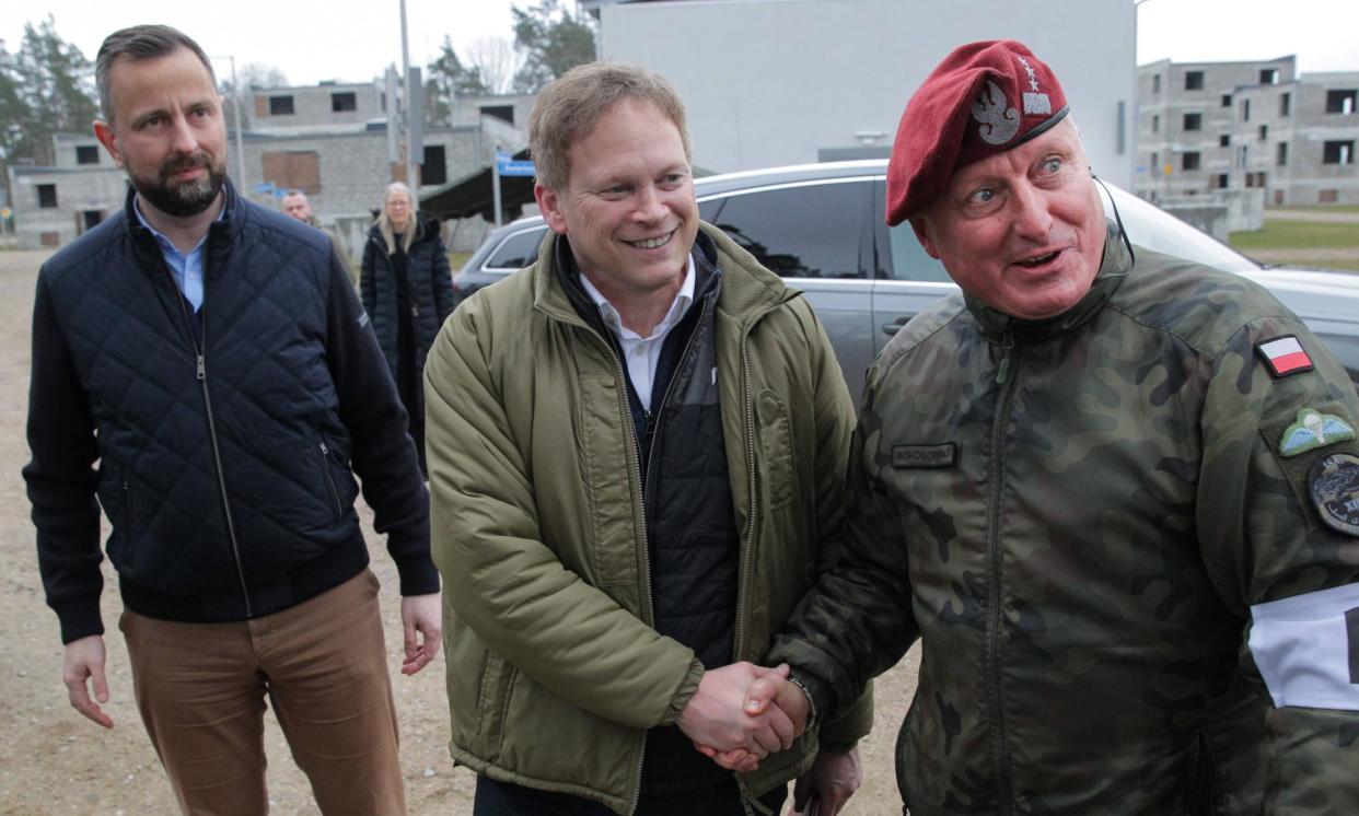 <span>Polish deputy prime minister and minister of national defence Wladyslaw Kosiniak-Kamysz (l), Grant Shapps (c) and 1st deputy commander general of the armed forces Marek Sokolowski at the Orzysz training ground in north-east Poland on 13 March.</span><span>Photograph: Tomasz Waszczuk/EPA</span>