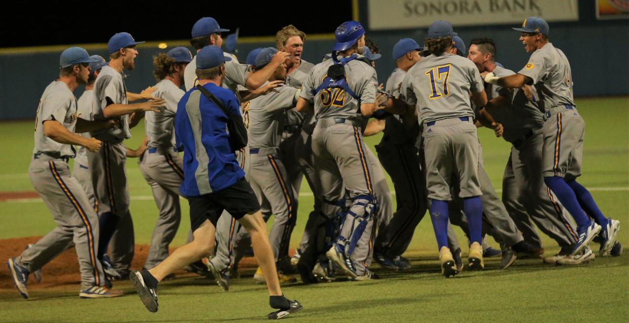 The Angelo State University baseball team celebrates after beating Colorado Mesa in Game 3 of the South Central Super Regional at Foster Field at 1st Community Credit Union Stadium on Saturday, May 28, 2022. The Rams punched their ticket to the NCAA D-II College World Series for the second-straight year.