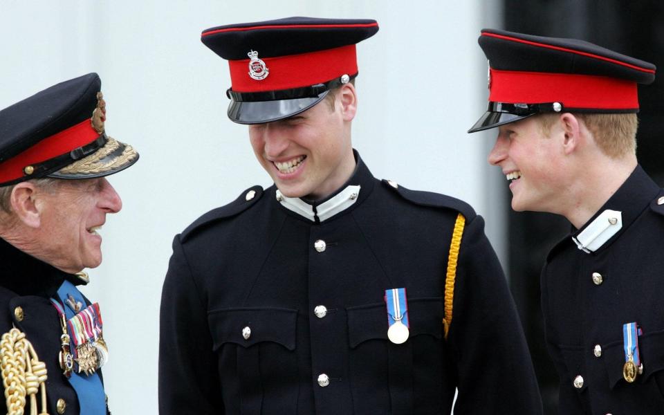 The Duke of Edinburgh with Prince William and Prince Harry at Sandhurst in 2006 - PA