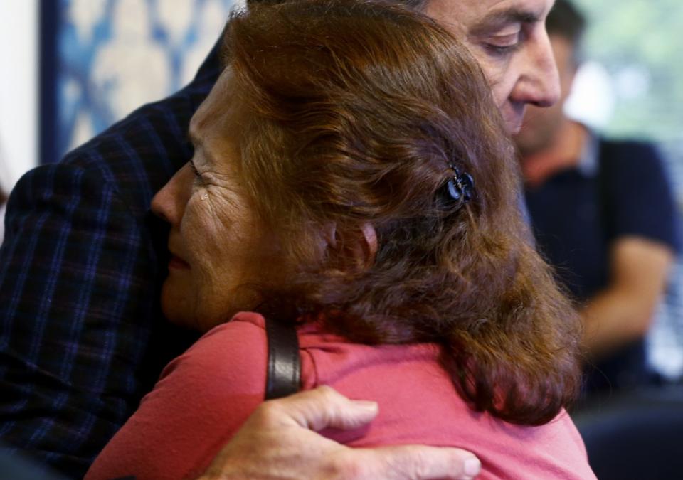 Eva Hernandez cries during a press conference in Pasadena.