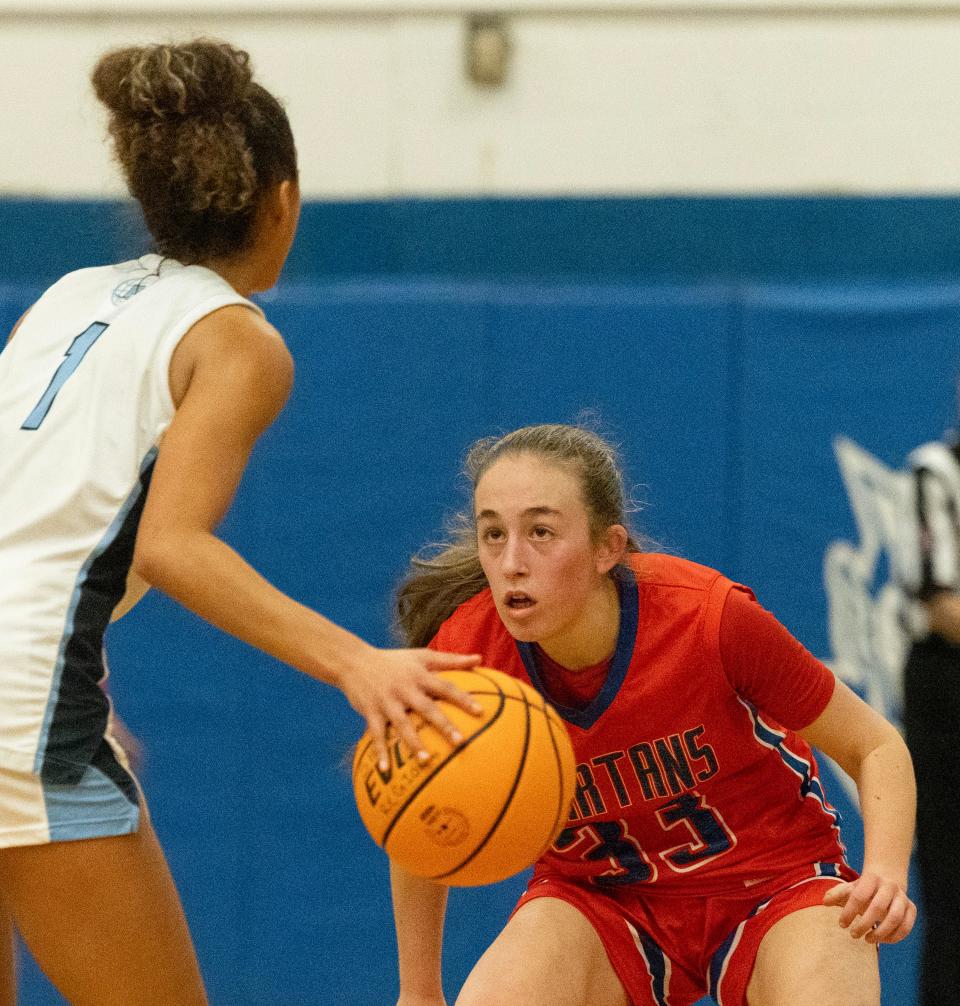 Ocean Kayden Clark closely guards Freehold Gaby Parker. Ocean Twp. Girls Basketball defeats Freehold Township in Blue Devil Holiday Invitational in West Long Branch on December 28, 2023.
