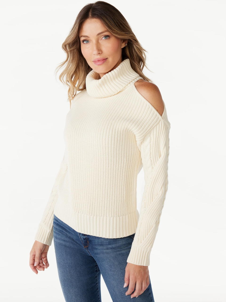 a model wearing the sweater in cream