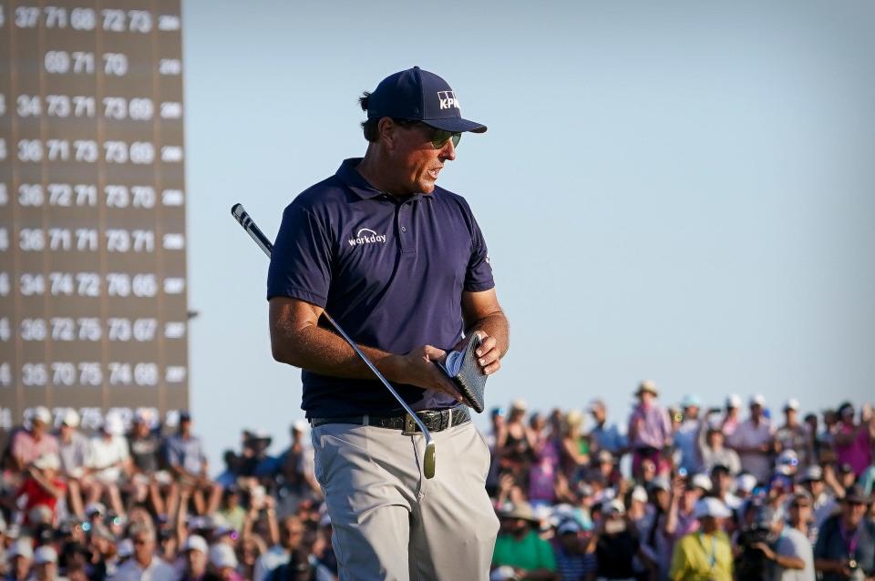 Phil Mickelson prepares to putt on the 18th green during the final round of the 2021 PGA Championship, an event he won.
