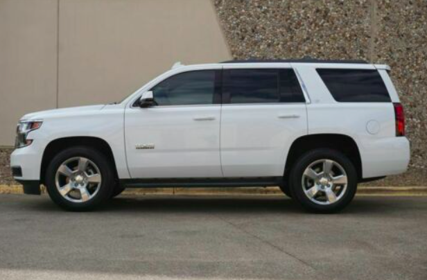 A white SUV parked on the street