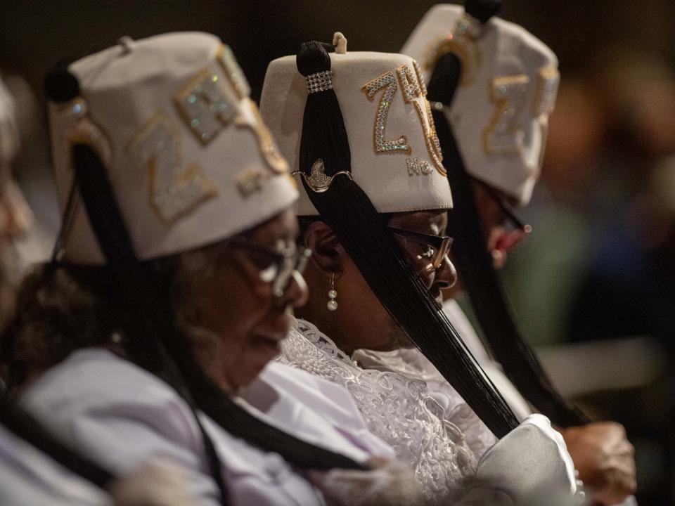 Attendees mourn as Rev. Willie Boyle leads in prayer during Shirlene Mercer's funeral service inside Carl Perkins Civic Center on Wednesday, Aug. 9, 2023.