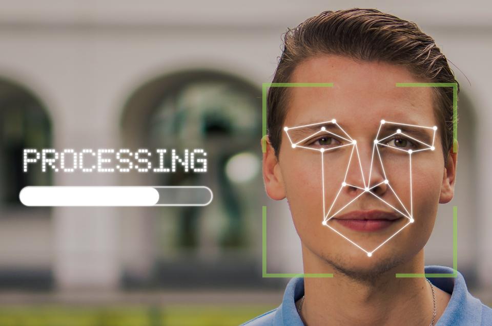 A person's face with identity theft scanning overlaid