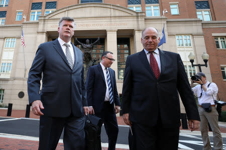 Defense attorneys Kevin Downing, Brian Ketcham and Thomas Zehnle leave the U.S. District Courthouse following the first day of jury deliberations in former Trump campaign manager Paul Manafort's trial on bank and tax fraud charges stemming from Special Counsel Robert Mueller's investigation of Russia's role in the 2016 U.S. presidential election, in Alexandria, Virginia, U.S., August 16, 2018. REUTERS/Chris Wattie