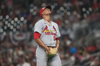 St. Louis Cardinals relief pitcher Johan Oviedo reacts after being hit by a line drive in the sixth inning of a baseball game against the Atlanta Braves, Monday, July 4, 2022, in Atlanta. (AP Photo/Butch Dill)