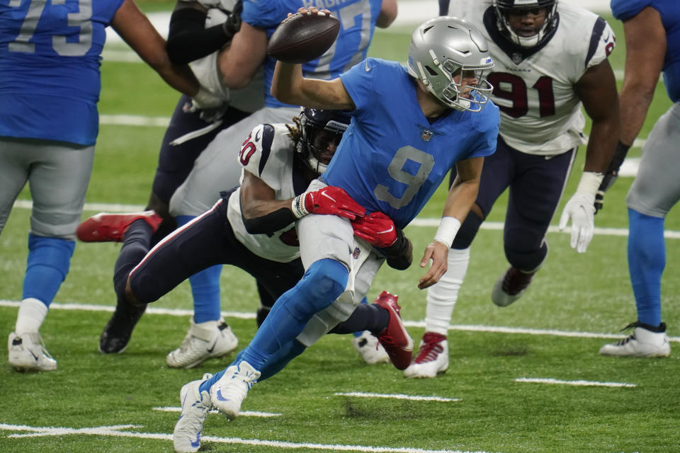 Houston Texans strong safety Justin Reid (20) sacks Detroit Lions quarterback Matthew Stafford (9) during the second half of an NFL football game, Thursday, Nov. 26, 2020, in Detroit. (AP Photo/Paul Sancya)