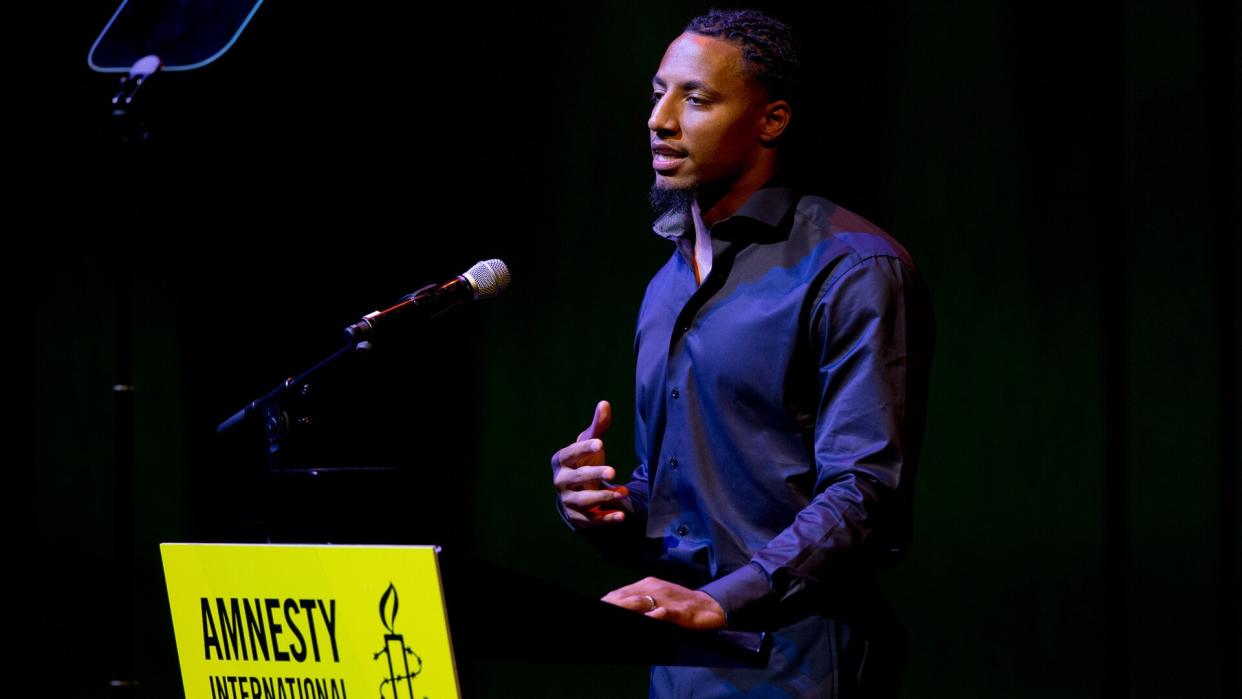 Former NFL quarterback and social justice activist Eric Reid speeches for his friend and colleague Colin Kaepernick who was awarded the Amnesty International Ambassador of Conscience Award for 2018 in Amsterdam, .