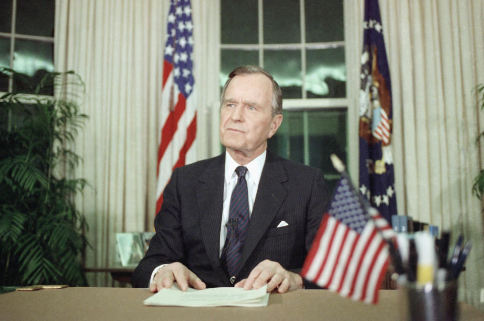 Bush in the Oval Office of the White House on Jan. 16, 1991, after announcing the U.S. attack on Iraq in the first Gulf War. (Photo: Doug Mills/AP