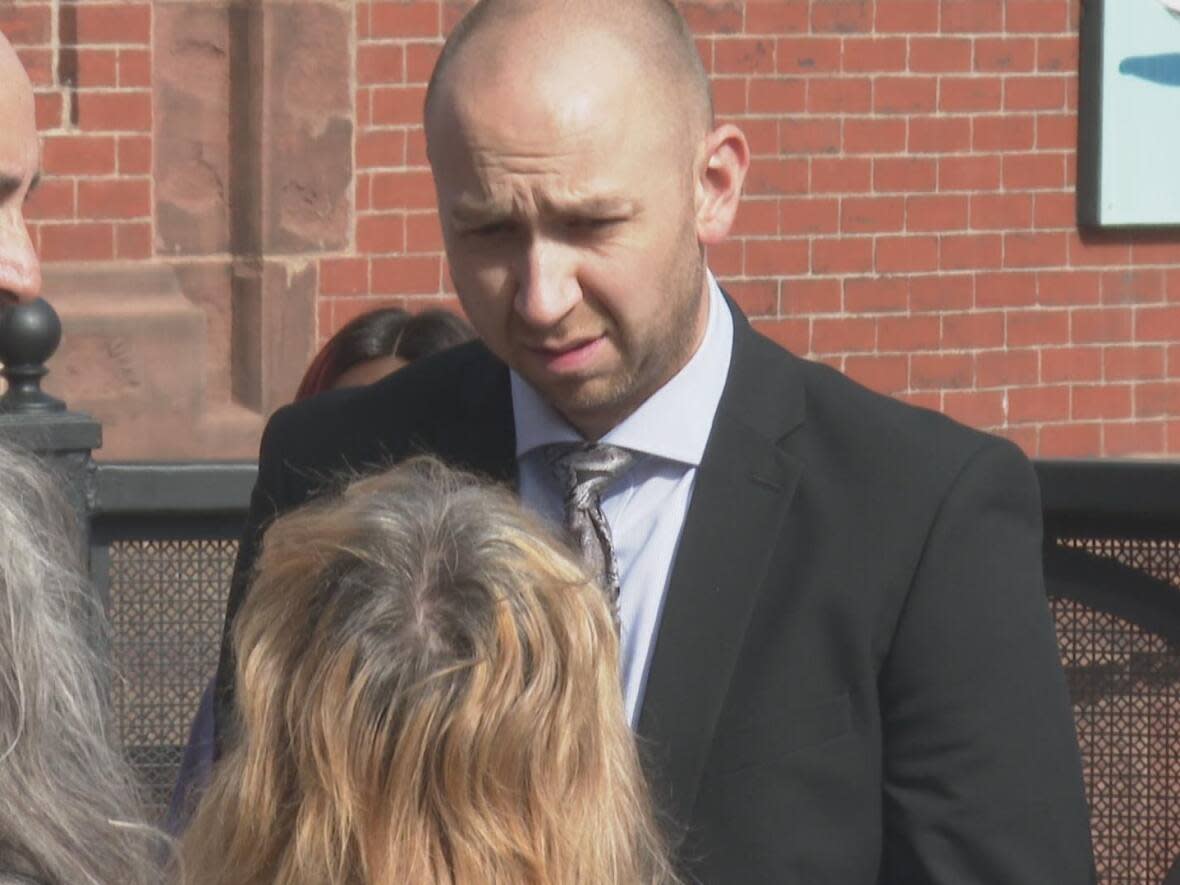 Philip Hutchings, pastor and founder of His Tabernacle Family Church, outside the courthouse in Saint John on Friday afternoon. He was remanded to jail until his next court appearance on Oct. 22.  (Shane Fowler/CBC - image credit)