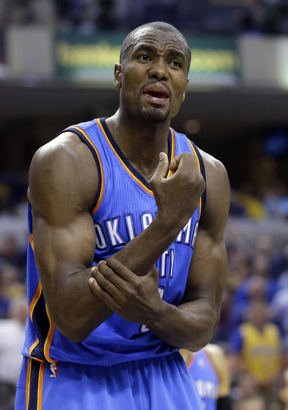 Oklahoma City Thunder forward Serge Ibaka complains about a call in the second half of an NBA basketball game against the Indiana Pacers in Indianapolis, Sunday, April 13, 2014. Ibaka was called for a technical for the exchange with an official. The Pacers defeated the Thunder 102-97. (AP Photo/Michael Conroy)