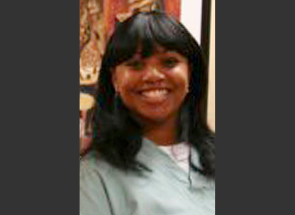 FILE - This 2011 file photo provided by Dr. Barry Weiss, from the website of Advanced Periodontics in Hamden, Conn., shows former employee Miriam Carey. Carey was shot to death after a car chase in October 2013 that went from the White House to near the U.S. Capitol. The attorney for Carey's family says her autopsy finds that she was shot multiple times from behind, including a shot to the back of the head. (AP Photo/Advanced Periodontics, File)