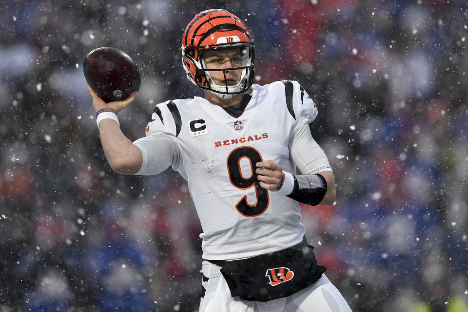 Cincinnati Bengals quarterback Joe Burrow (9) passes against the Buffalo Bills during the third quarter of an NFL division round football game, Sunday, Jan. 22, 2023, in Orchard Park, N.Y. (AP Photo/Adrian Kraus)