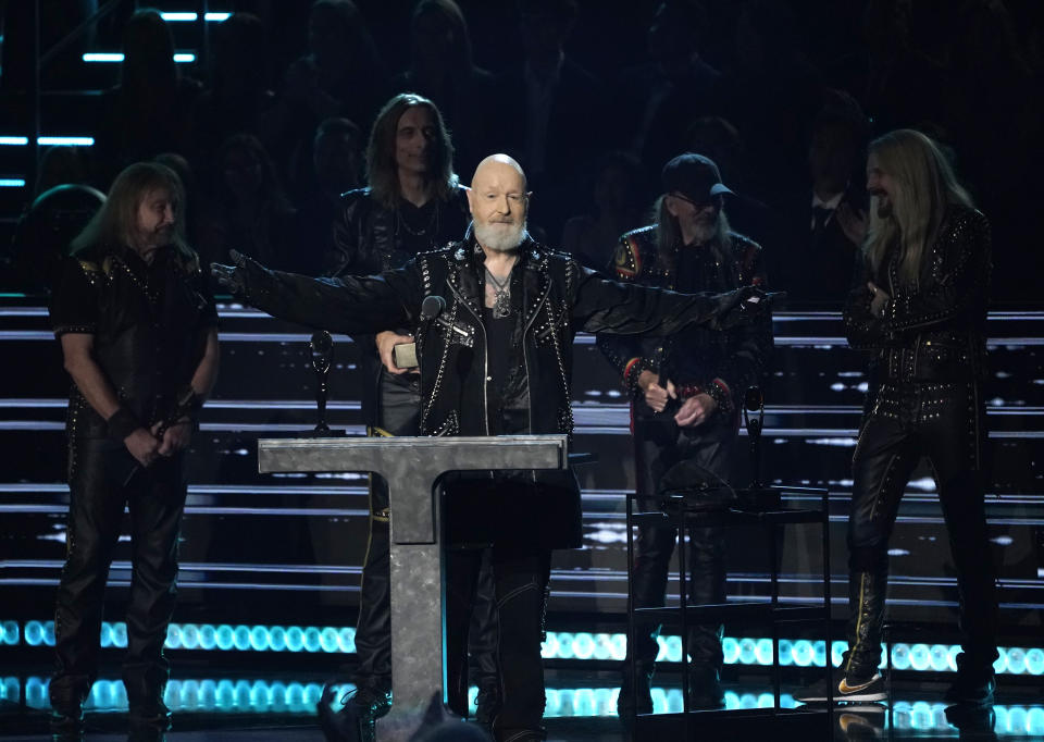 Inductees Ian Hill, from left, Scott Travis, Rob Halford, Glenn Tipton, and Richie Faulkner of Judas Priest speak during the Rock & Roll Hall of Fame Induction Ceremony on Saturday, Nov. 5, 2022, at the Microsoft Theater in Los Angeles. (AP Photo/Chris Pizzello)