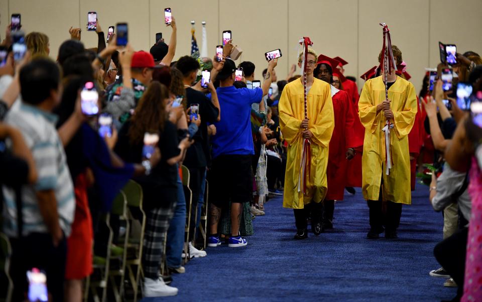 With phones held high, family members eagerly captured the opening moments of the South High graduation at the DCU Center on Wednesday.