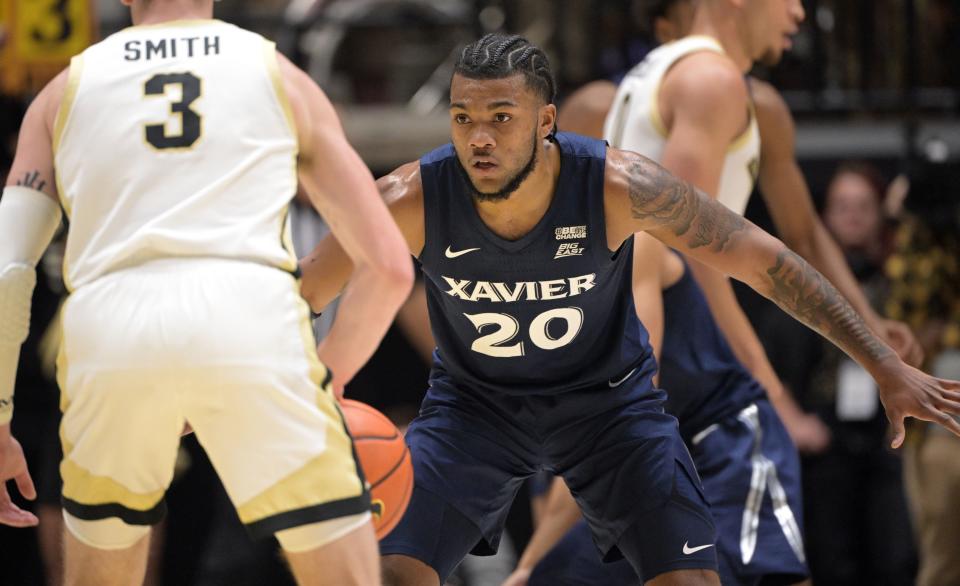 Nov 13, 2023; West Lafayette, Indiana, USA; Xavier Musketeers guard Dayvion McKnight (20) defends against Purdue Boilermakers guard Braden Smith (3) during the first half at Mackey Arena.