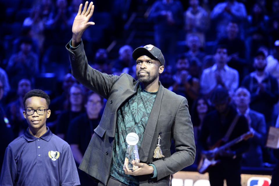 Luol Deng, right, accepts the 18th annual National Civil Rights Museum Sports Legacy Award along with fellow honorees Gary Payton, Nancy Lieberman, and Eddie George before the 21st annual Martin Luther King Jr. Day Celebration Game between the Phoenix Suns and the Memphis Grizzlies, Monday, Jan. 16, 2023, in Memphis, Tenn. (AP Photo/Brandon Dill)