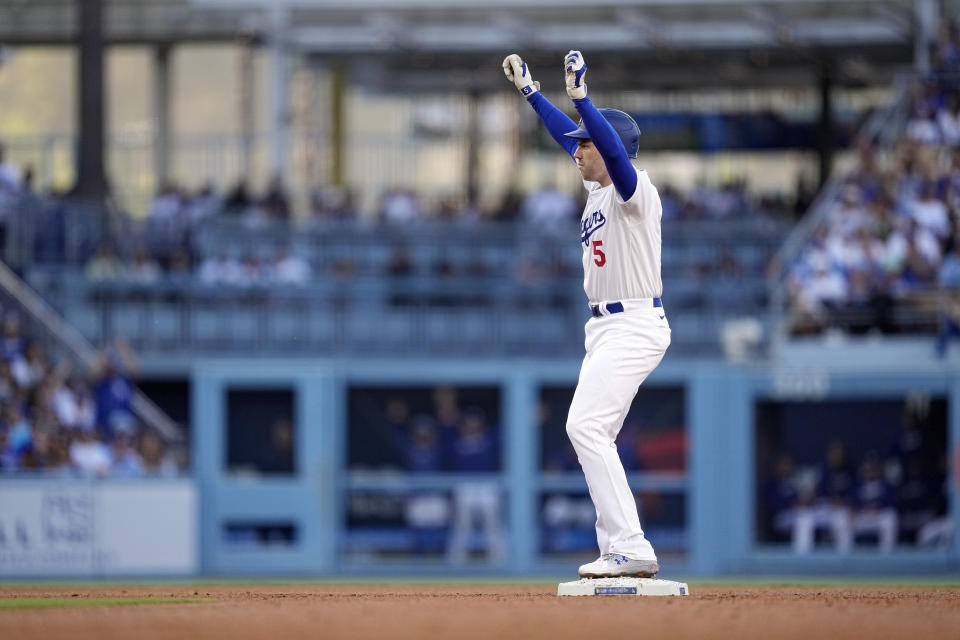 Los Angeles Dodgers' Freddie Freeman gestures toward his dugout after hitting a double during the fourth inning of a baseball game against the Kansas City Royals Saturday, June 15, 2024, in Los Angeles. (AP Photo/Mark J. Terrill)