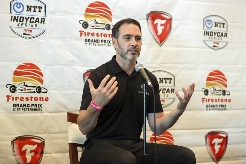 FILE -Jimmie Johnson speaks about joining the team of Chip Ganassi for the IndyCar series at a press conference during the IndyCar race weekend Saturday, Oct. 24, 2020, in St. Petersburg, Fla. Johnson returns to Texas Motor Speedway this weekend searching for some of his old NASCAR magic. He won seven times at Texas as a NASCAR driver and the track renamed victory lane for him following his 2020 retirement. Now he's back to run his first oval race as an IndyCar driver. (AP Photo/Mike Carlson, File)