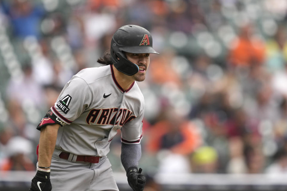 Arizona Diamondbacks left fielder Corbin Carroll runs to first for a RBI single during the ninth inning of a baseball game against the Detroit Tigers, Sunday, June 11, 2023, in Detroit. (AP Photo/Carlos Osorio)