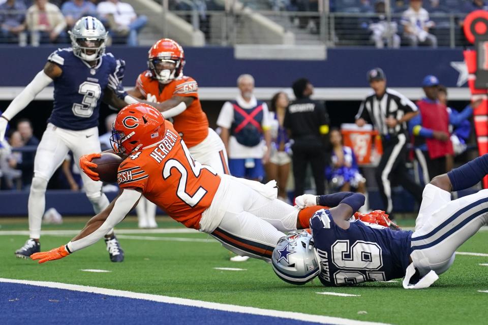 Chicago Bears' Khalil Herbert gets past Dallas Cowboys' DaRon Bland for a touchdown run during the second half of an NFL football game Sunday, Oct. 30, 2022, in Arlington, Texas. (AP Photo/Nam Y. Huh)