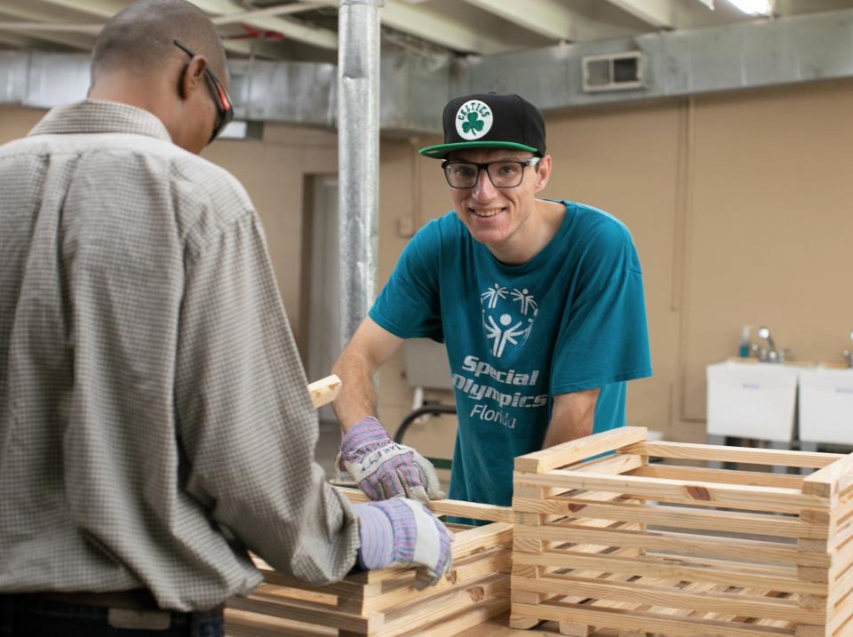 Two Pine Castle participants create large planter boxes in the nonprofit's woodshop. The Jacksonville nonprofit serves intellectually and developmentally disabled adults.