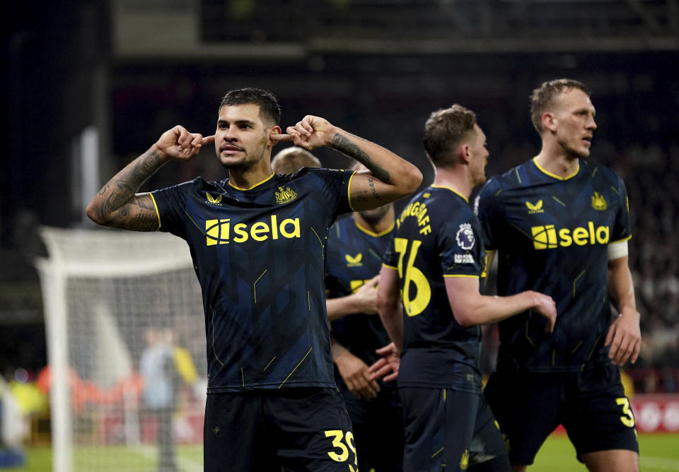 Newcastle United's Bruno Guimaraes celebrates scoring their side's third goal of the game during the English Premier League soccer match between Newcastle United and Nottingham Forest at the City Ground in Nottingham, Saturday Feb. 10, 2024. (Bradley Collyer/PA via AP)