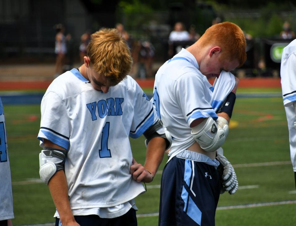 York’s Laird Masterson, left, and Nick Hoy took Saturday’s sudden death overtime loss to Yarmouth hard, 13-12.