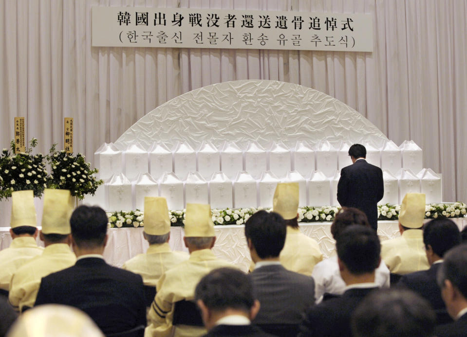 A ceremony to commemorate the returning to South Korea the remains of Korean solders who died while serving in the Japanese Army during World War II, is held at Buddhist temple, Yutenji, in Tokyo on May 18, 2010. About 700 remains of the Korean war-dead have been separately stored at the temple. Health and welfare ministry officials say they are the only remains of the former Korean soldiers that they are aware of. More than half of the 700 are from North Korea. Several hundred remains had been previously returned to their homes through diplomatic arrangement, but talks have been stalled in recent years as diplomatic relations have soured over Japan’s wartime actions.(Kyodo News via AP)