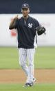 New York Yankees shortstop Derek Jeter warms up before an exhibition baseball game against the Pittsburgh Pirates Thursday, Feb. 27, 2014, in Tampa, Fla. (AP Photo/Charlie Neibergall)