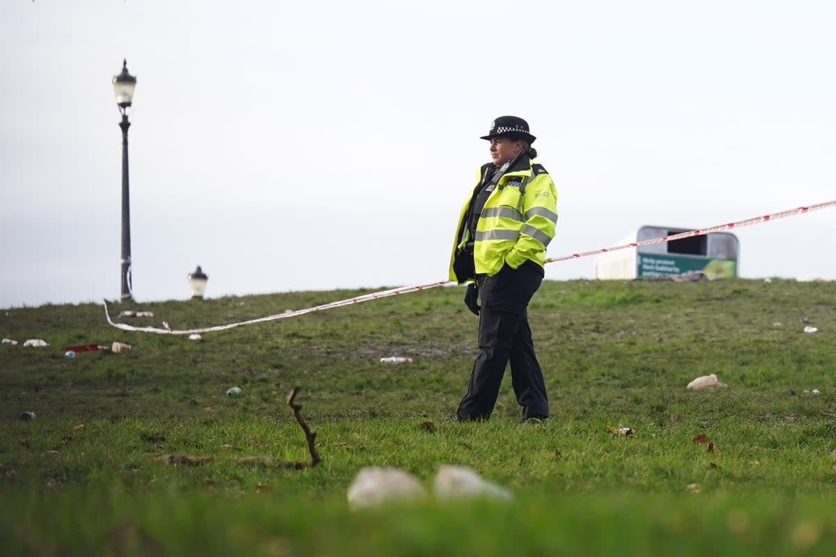 Extensive police cordons remain in place as officers conduct a forensic examination of the scene and the surrounding area (PA)