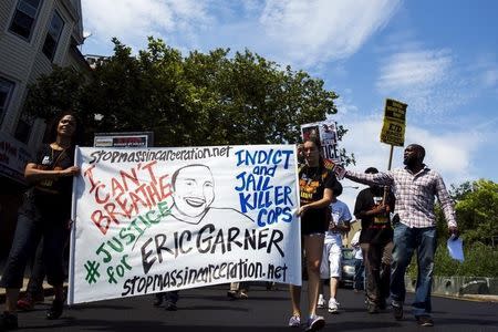 Demonstrators protest as they march to the location where Eric Garner was killed on the one year anniversary of his death in New York, July 17, 2015. REUTERS/Lucas Jackson