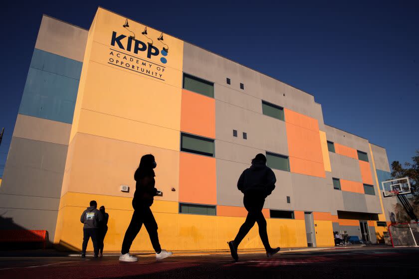 Los Angeles, CA - December 09: KIPP Empower Academy Middle School students in play yard. KIPP, a charter school, bought a seedy motel for $4.7 million than immediately tore down the structure located between its elementary and middle school located on Figueroa St. on Friday, Dec. 9, 2022 in Los Angeles, CA. (Irfan Khan / Los Angeles Times)