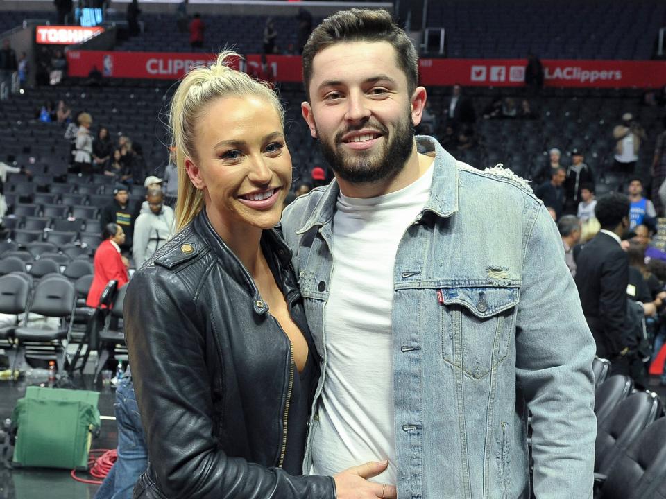 Baker Mayfield and Emily Wilkinson attend a basketball game between the Los Angeles Clippers and the Oklahoma City Thunder at Staples Center on January 4, 2018 in Los Angeles, California