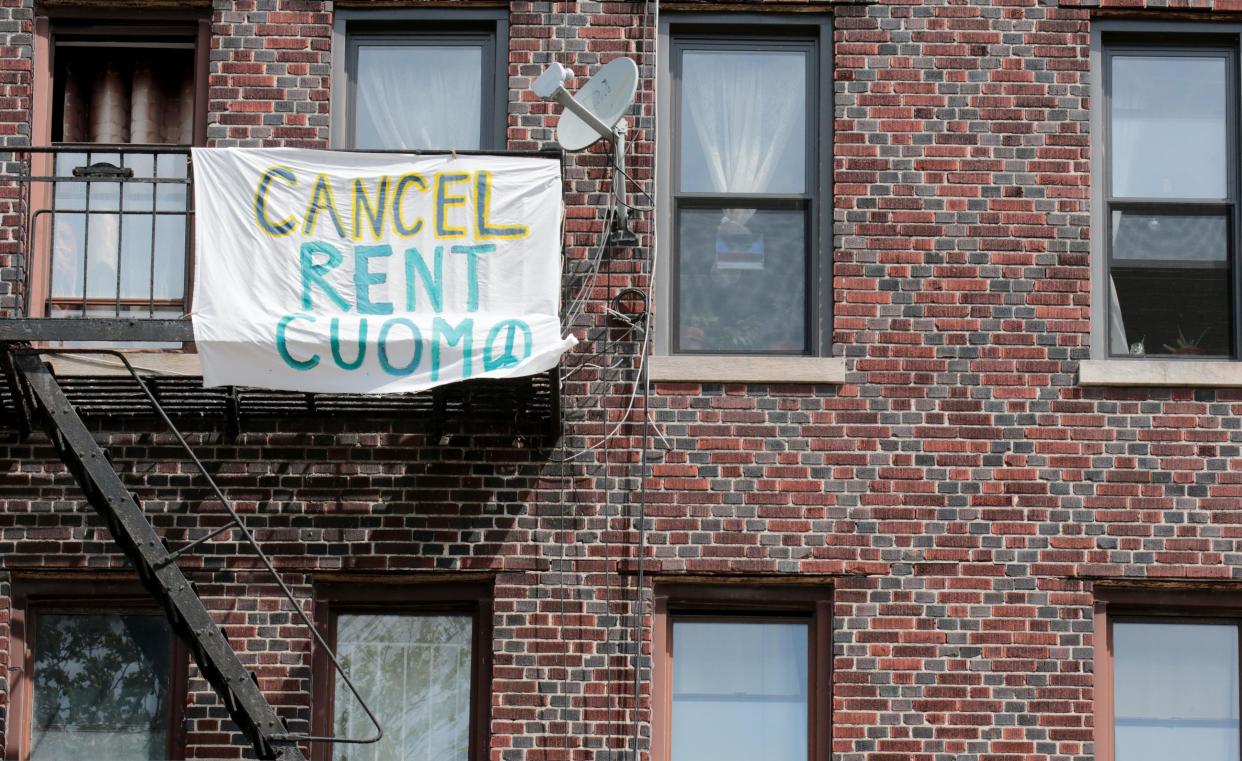 A banner asking Gov. Cuomo to cancel rent hangs on a building on Madison St. in Brooklyn.