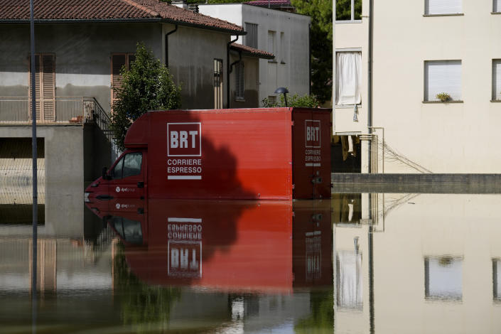 A truck is submerged in Faenza, Italy, Thursday, May 18, 2023. Exceptional rains Wednesday in a drought-struck region of northern Italy swelled rivers over their banks, killing at least eight people, forcing the evacuation of thousands and prompting officials to warn that Italy needs a national plan to combat climate change-induced flooding. (AP Photo/Luca Bruno)