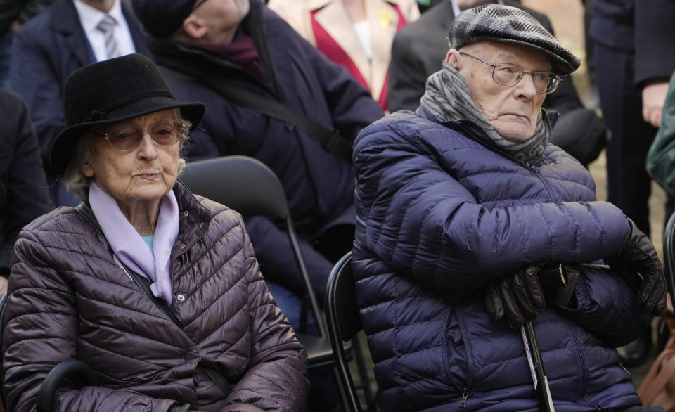 Anna Stupnicka-Bando, left, a Polish Christian honored for saving Jews, and Waclaw Kornblum, right, a Polish Holocaust survivor, attend a ceremony for the burial of a "time capsule" on the grounds of the Warsaw Ghetto Museum in Warsaw, Poland, on Tuesday April 18, 2023. The time capsule contains memorabilia and a message to future generations. It was buried on the grounds of a former children's hospital, a building that will house the Warsaw Ghetto Museum, which is scheduled to open in three years. Tuesday's ceremony comes on the eve of the 80th anniversary of the Warsaw Ghetto Uprising, the largest single Jewish revolt against German forces during the Holocaust. (AP Photo/Czarek Sokolowski)