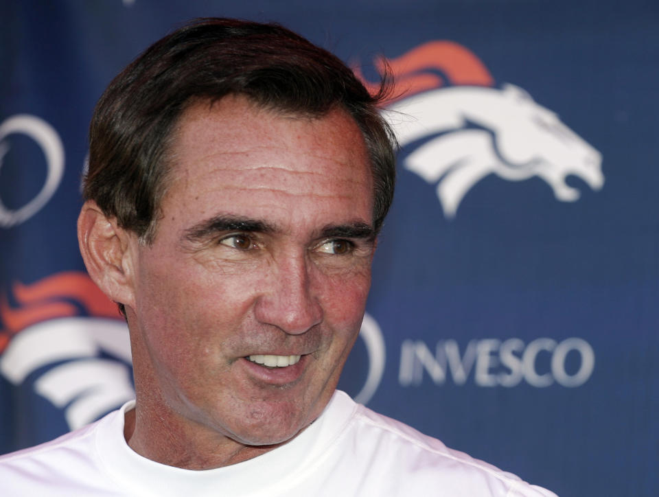 FILE - Denver Broncos head coach Mike Shanahan laughs as he talks to the media following the morning session of football training camp in Denver, Sunday, July 29, 2007. Versatile running back Roger Craig, and two-time Super Bowl-winning coaches Tom Coughlin and Mike Shanahan advanced to the next stage of consideration for the Pro Football Hall of Fame. The selection committees cut down the list of candidates from 31 seniors and 29 coaches and contributors to 12 in each category in results announced Thursday, July 27, 2023. (AP Photo/Jack Dempsey, File)
